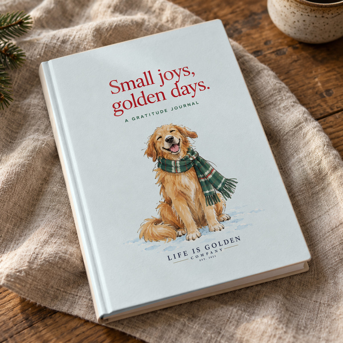 Small Joys, Golden Days — close angled view of the matte hardcover Winter Gratitude Journal