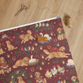 Five Golden Rings Wrapping Paper — unrolled on the table with scissors, twine and a gift tag