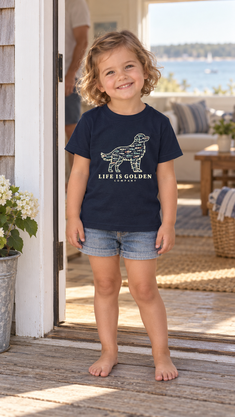 Fish Pattern Golden Toddler Tee in Navy, worn by a child