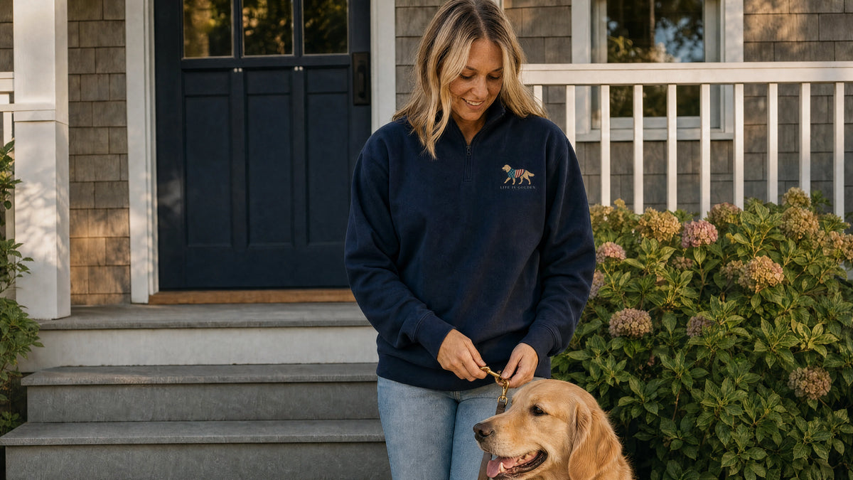 on her front steps in crisp early-evening light, facing forward as she clips her golden retriever’s leash before their after-dinner walk