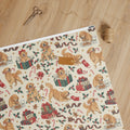 Naughty & Nice Wrapping Paper — unrolled on the table with scissors, twine and a gift tag
